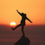 Man Balancing on Peak